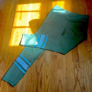 Olive green leggings with white mesh stripes